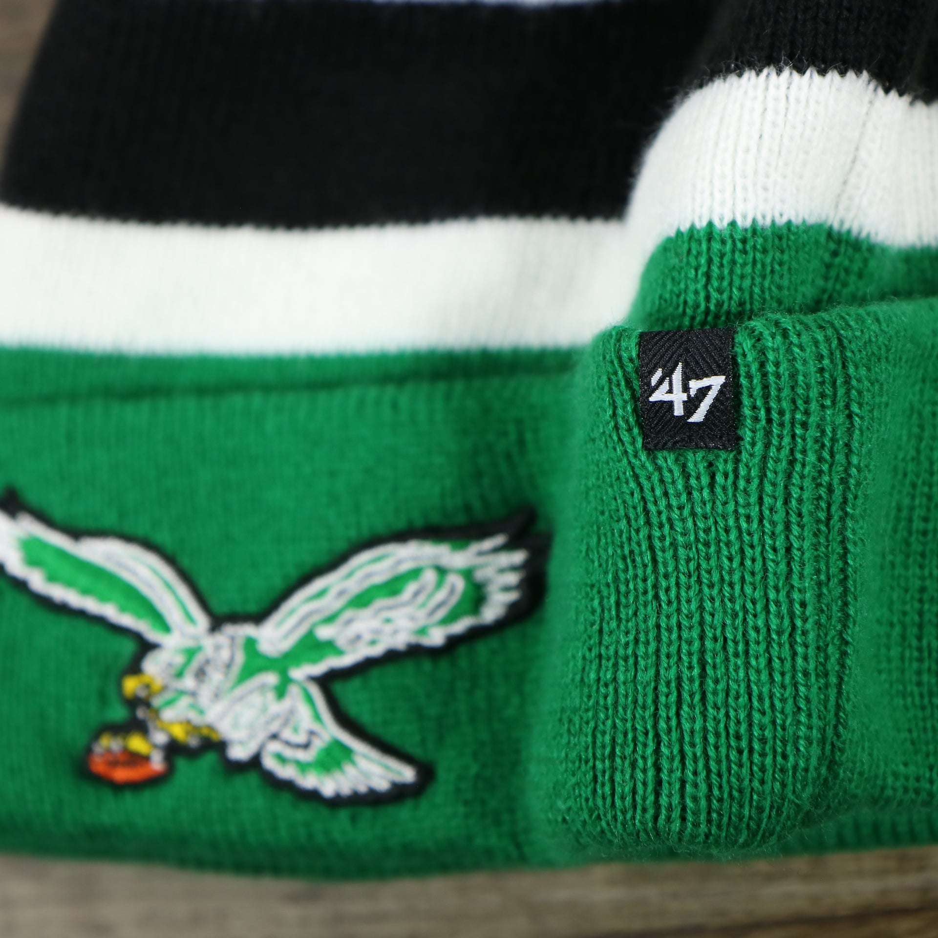 The 47 Brand Tag on the Legacy Philadelphia Eagles Cuffed Logo Striped Winter Beanie With Pom Pom | Kelly Green Winter Beanie
