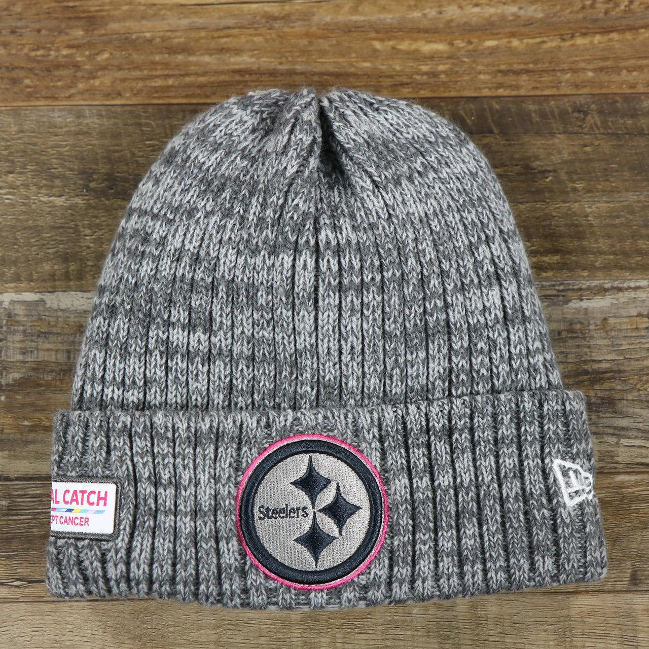 The front of the Pittsburgh Steelers On Field Crucial Catch Winter Knit Graphite Beanie | Gray Winter Beanie