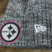 The New Era Logo on the Pittsburgh Steelers On Field Crucial Catch Winter Knit Graphite Beanie | Gray Winter Beanie