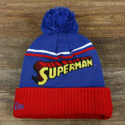The backside of the DC Comics Superman S-Shield Logo Superman Wordmark Striped Beanie With Blue Pom Pom | Blue And Red Winter Beanie