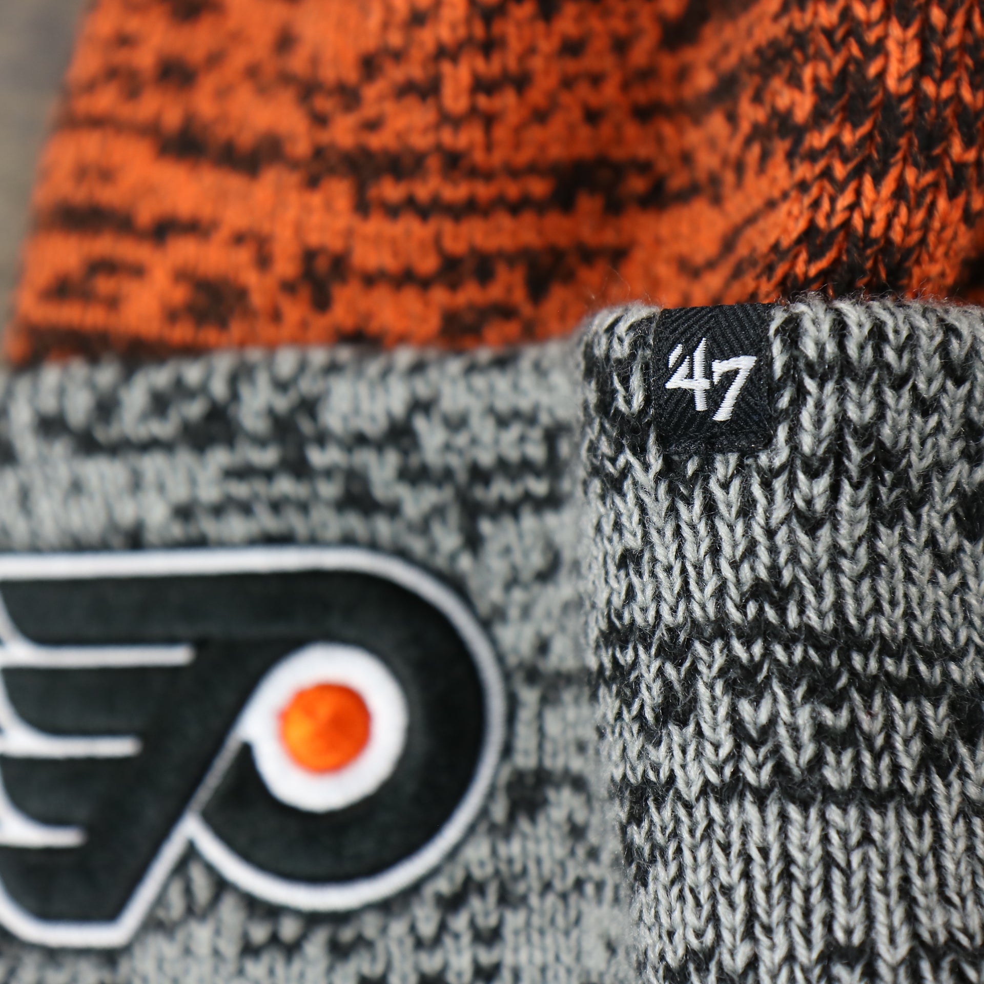 The 47 Brand Tag on the Philadelphia Flyers Static Knit Cuffed Winter Beanie With Pom Pom | Black, Orange, And Gray Beanie