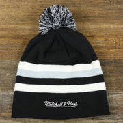 The backside of the Brooklyn Nets Cuffless Striped Winter Beanie With Pom Pom | Black, White, And Gray Beanie