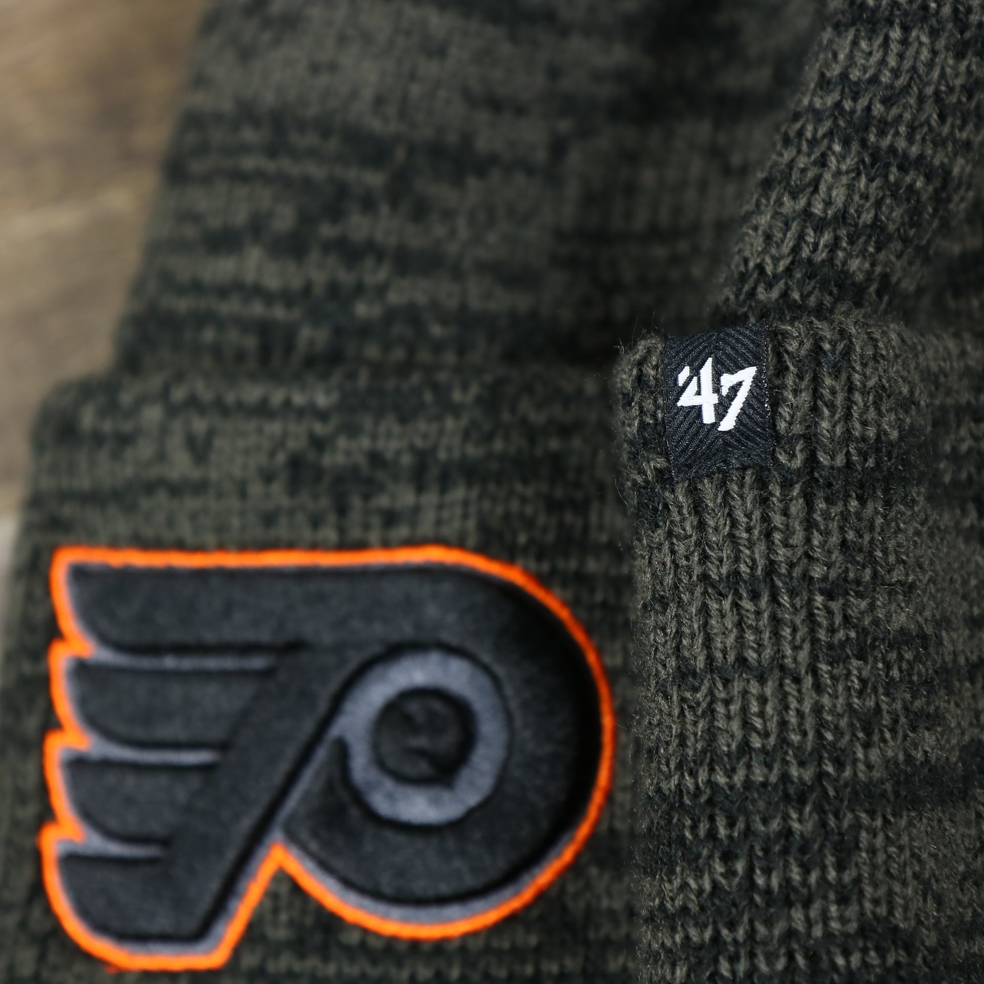 The 47 brand Tag on the Philadelphia Flyers Brain Freeze Heather Gray Winter Beanie | Black Winter Beanie