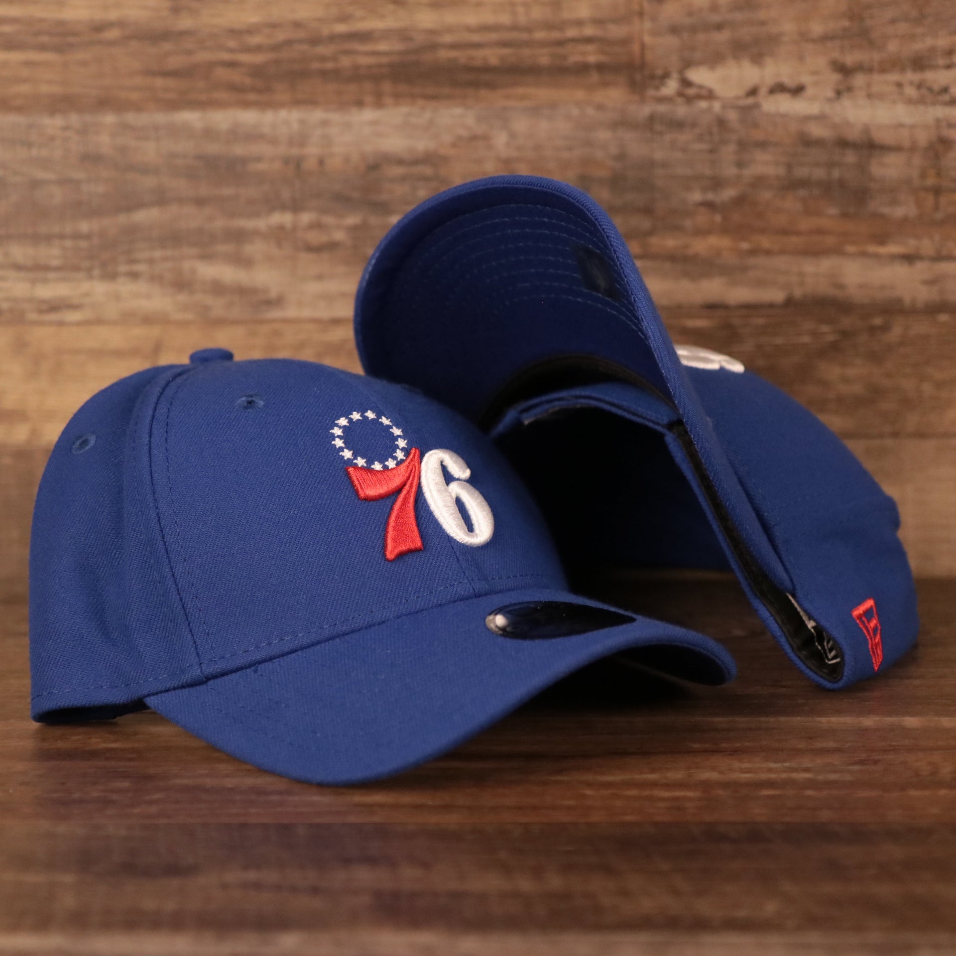 front and bottom of the Philadelphia 76ers Blue Adjustable Youth Dad Hat