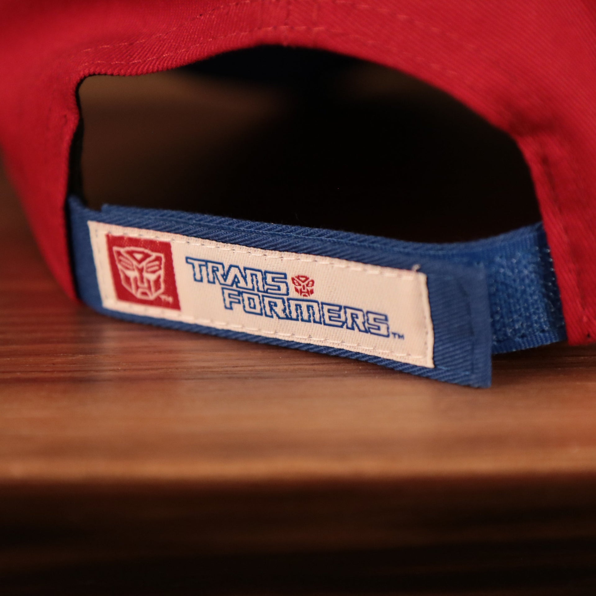 hook and loop strap on the back of the Transformers Auto Bots Red and White 9Twenty Adjustable Dad Hat