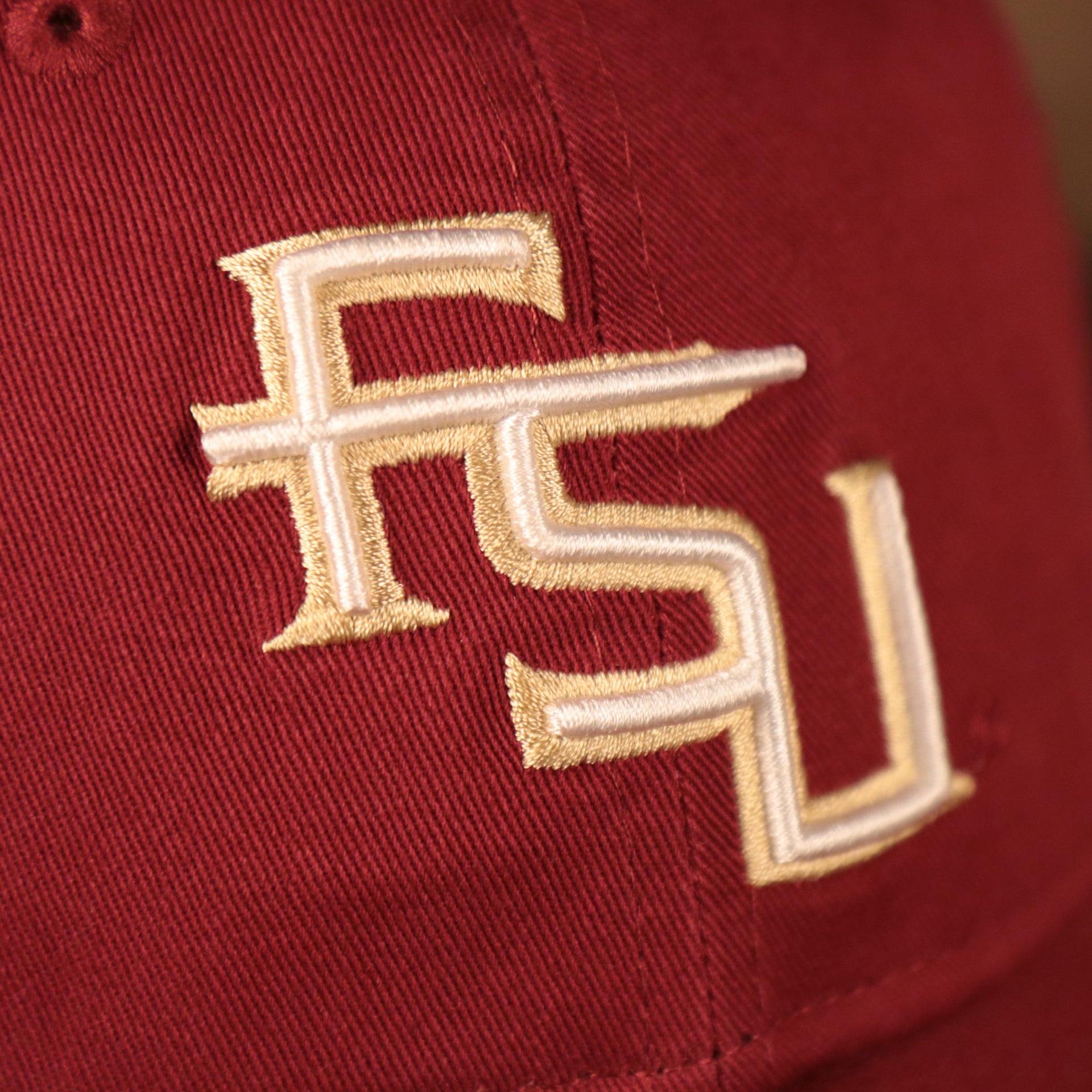 fsu logo on the Florida State Seminoles Maroon Adjustable 9Twenty Dad Hat
