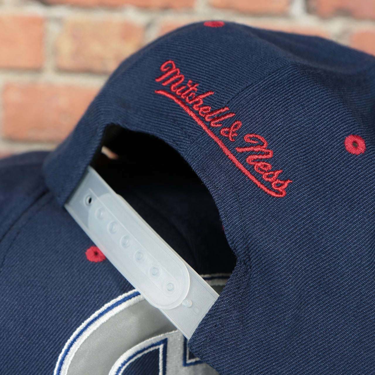 white adjustable snap on the Montreal Canadiens Navy Blue on Gray Reflective Snapback Hat