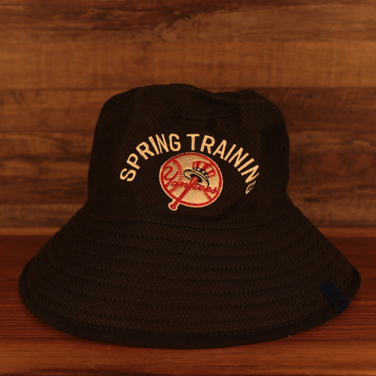 front of the New York Yankees Spring Training 2022 On Field Navy Bucket Hat