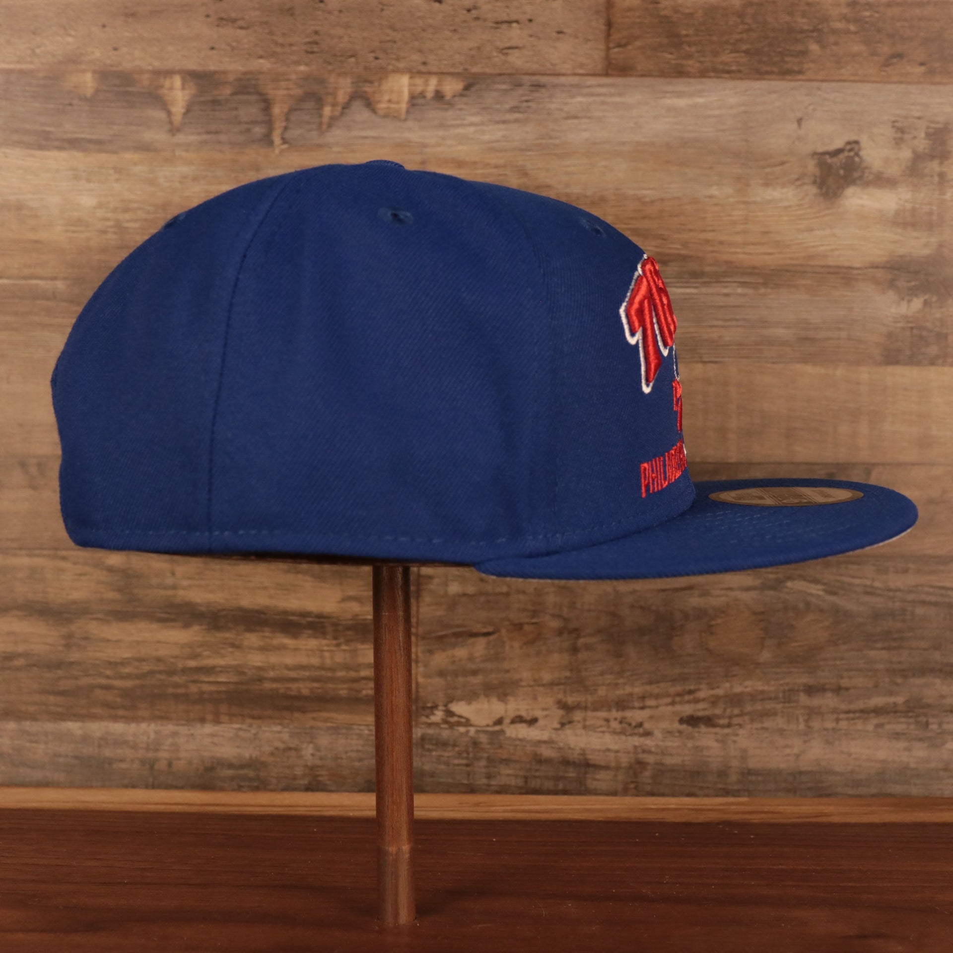 Wearer's right of the Vintage Philadelphia 76ers Cap | 1949 Philadelphia x Pennsylvania Royal 9Fifty Snapback Hat