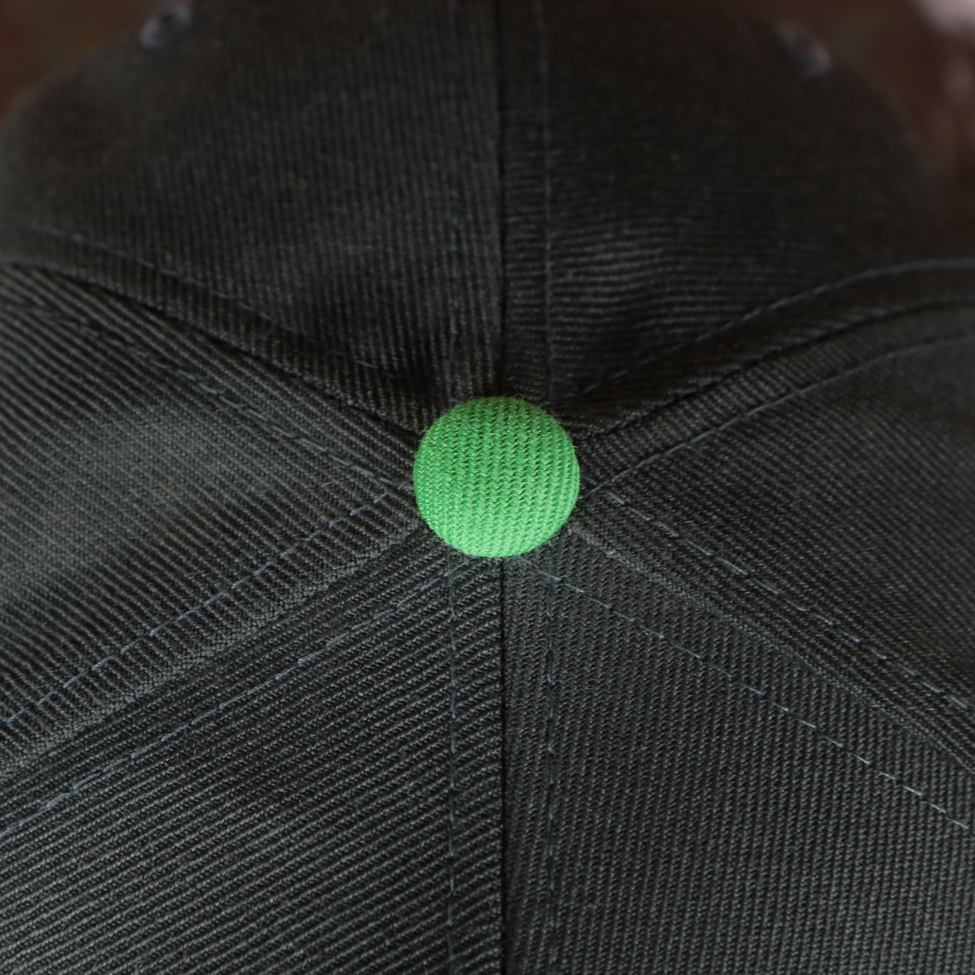 green button on the Seattle Sounders XL Logo Two Tone Snapback Hat
