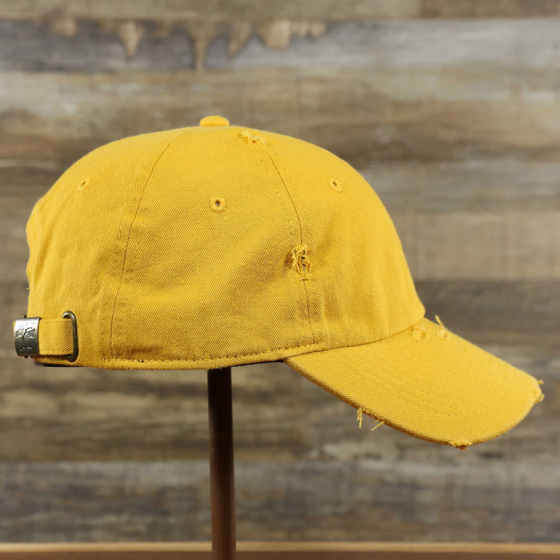 The wearer's right on the Mustard Yellow Flat Brim Distressed Blank Baseball Hat | Yellow Dad Hat