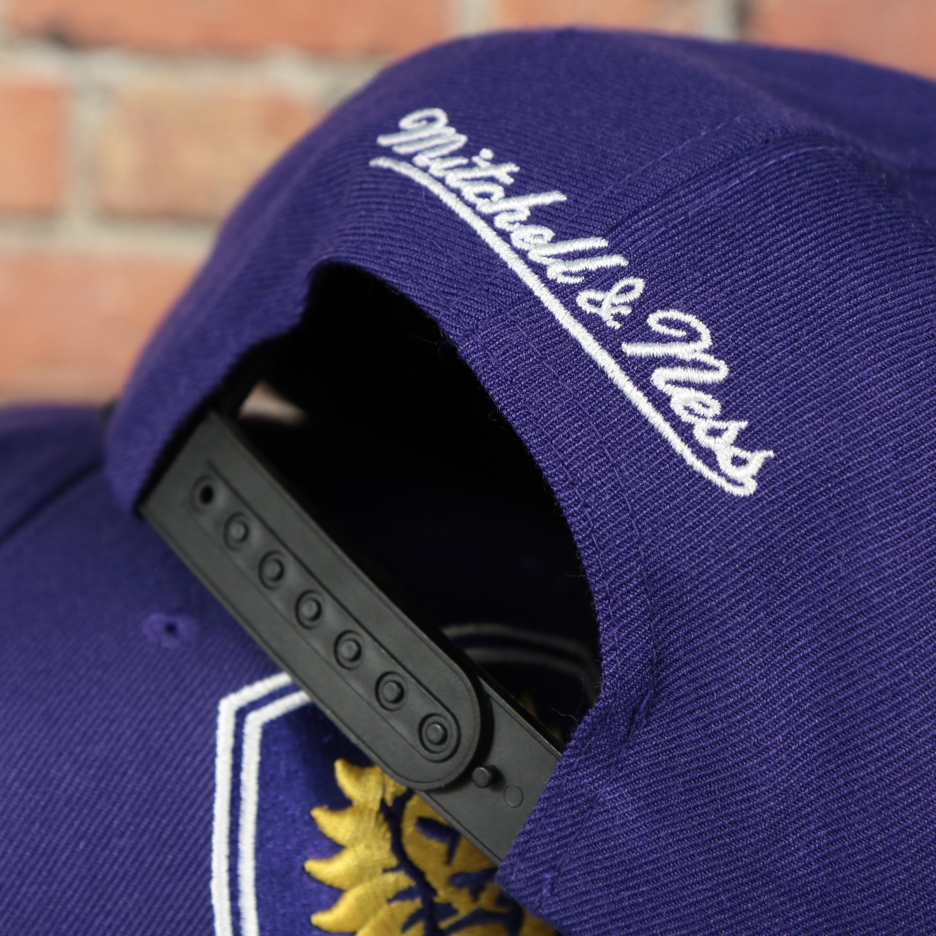 black adjustable snap on the Orlando City Lions XL Logo Two Tone Purple on Black Snapback Hat