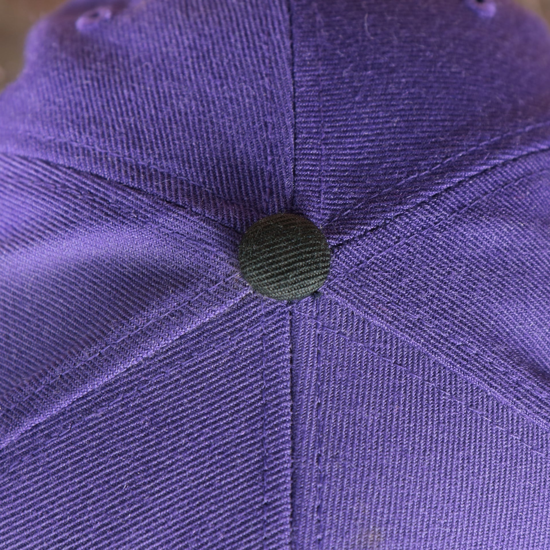 black button on the Orlando City Lions XL Logo Two Tone Purple on Black Snapback Hat
