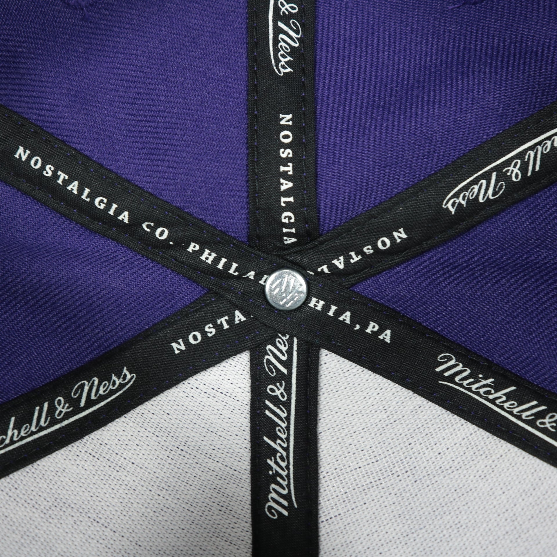 mitchell and ness taping on the Orlando City Lions XL Logo Two Tone Purple on Black Snapback Hat