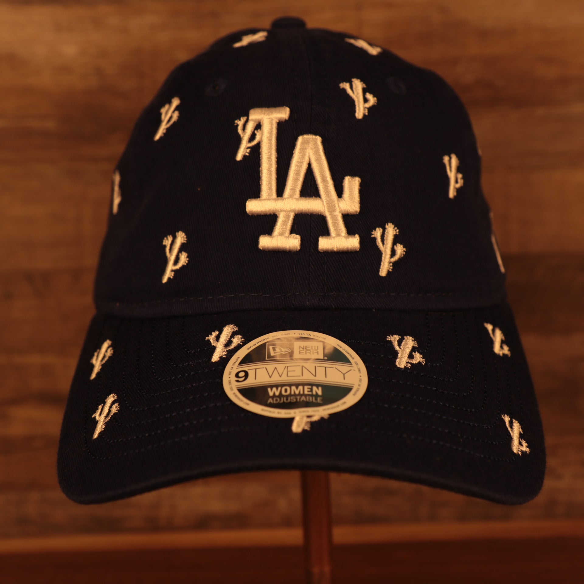 front of the Los Angeles Dodgers Spring Training 2022 Women's All Over Cactus Black 9Twenty Dad Hat