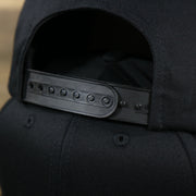 The Black Adjustable Strap on the Youth Jet Black Flat Brim Gray Bottom Blank Snapback Cap | Kid’s Black Snap Cap