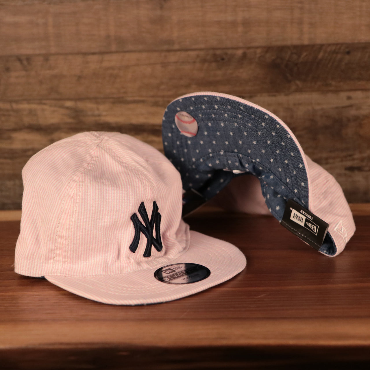 front and bottom of the New York Yankees Reversible Navy & Red Toddler 9Twenty Dad Hat