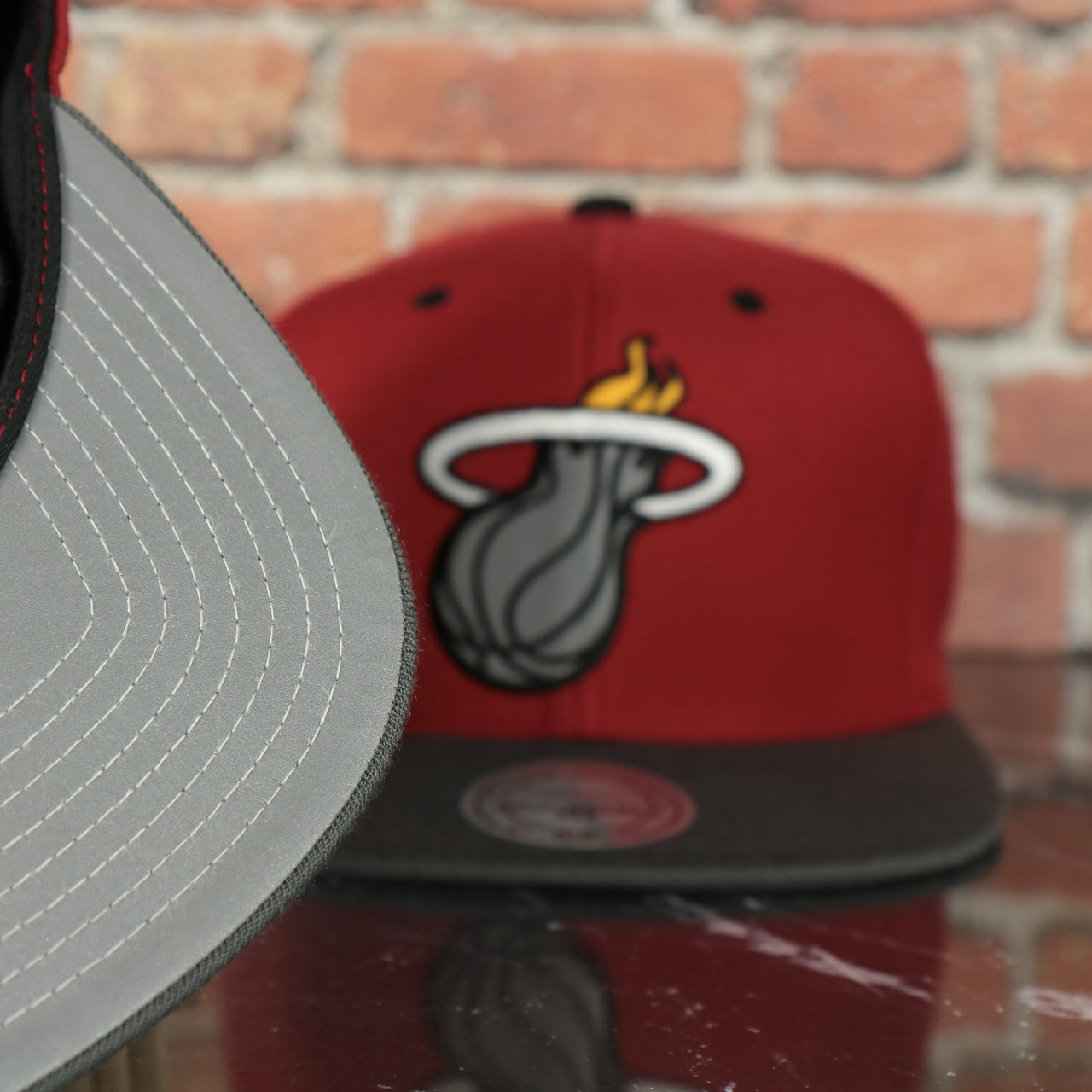 grey under visor on the Miami Heat Two Tone Reflective Snapback Hat