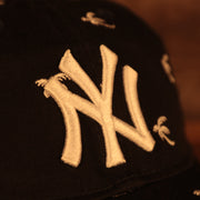 logo shot on the New York Yankees Spring Training 2022 Youth All Over Palm Tree Navy 9Twenty Dad Hat