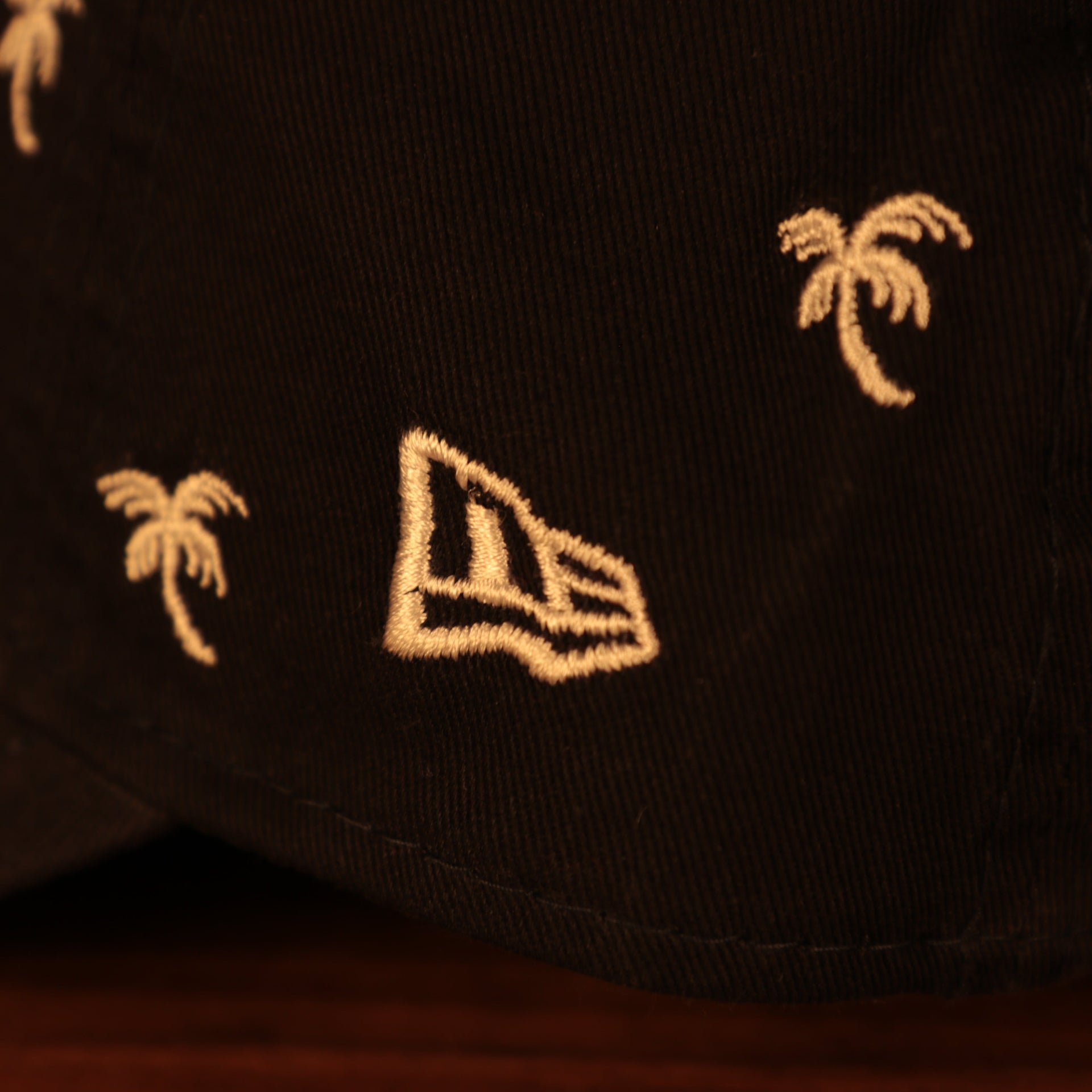 new era logo on the New York Yankees Spring Training 2022 Youth All Over Palm Tree Navy 9Twenty Dad Hat