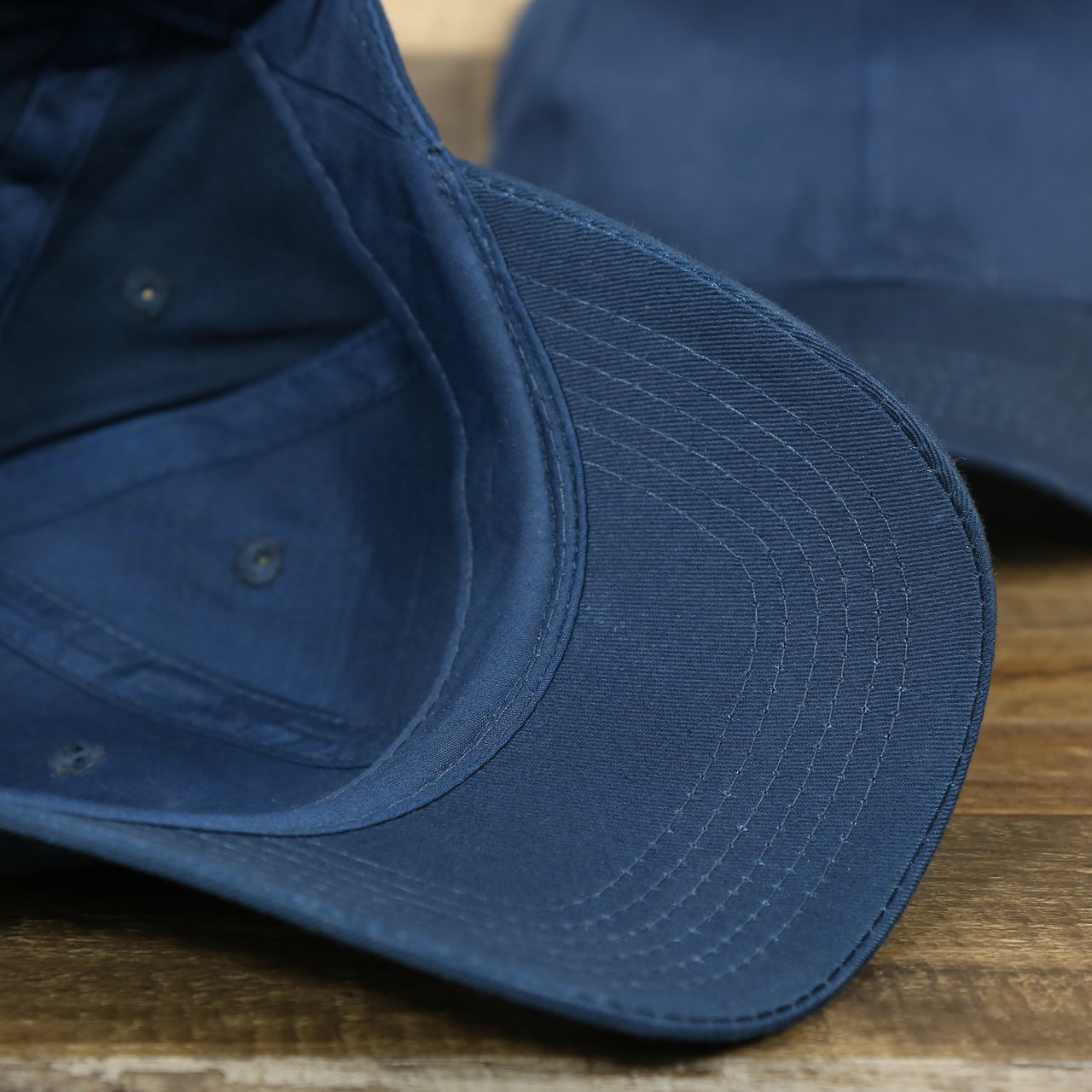 The undervisor on the Youth Navy Blue Flat Brim Blank Baseball Hat | Kid’s Dark Blue Dad Hat