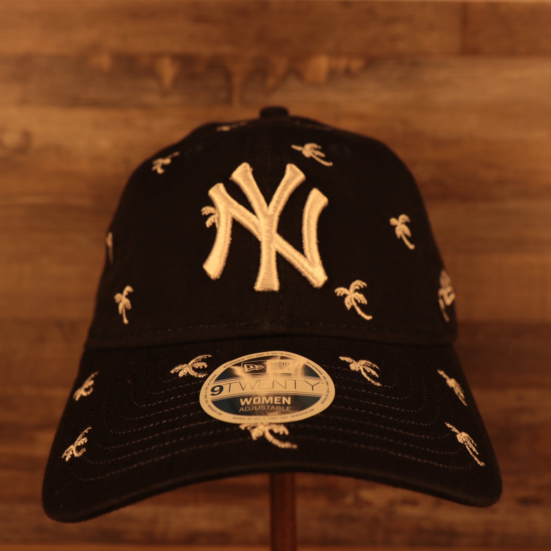 front of the New York Yankees Spring Training 2022 Women's All Over Palm Tree Navy 9Twenty Dad Hat