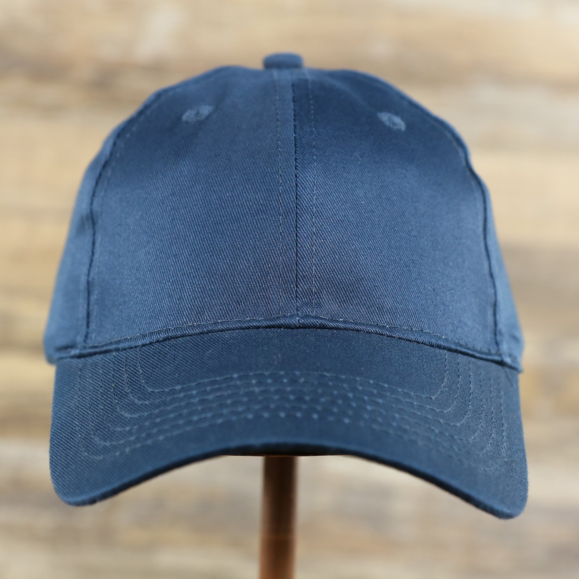 The front of the Youth Navy Blue Flat Brim Blank Baseball Hat | Kid’s Dark Blue Dad Hat