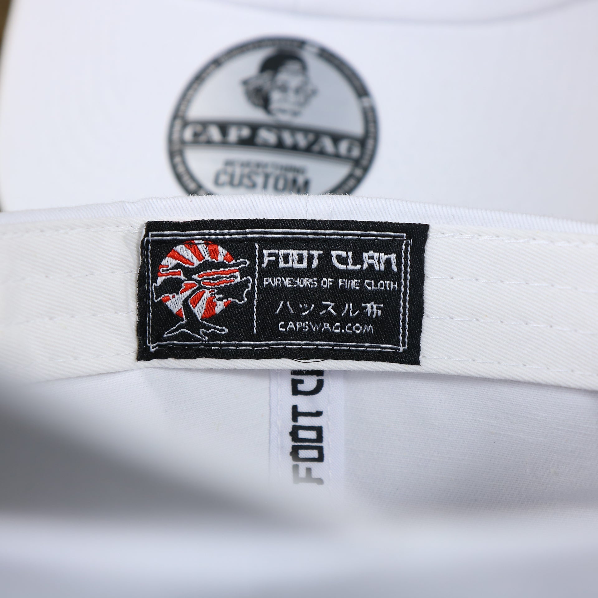 The Foot Clan Tag on the Snow White Blank Baseball Hat | White Dad Hat