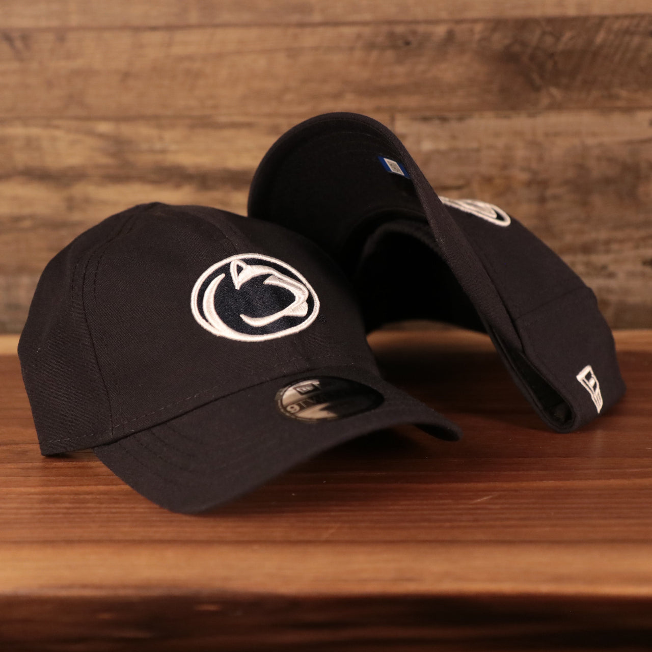front and bottom of the Penn State Nittany Lions Navy Nittany Lion logo Stretch Back Infant Dad Hat