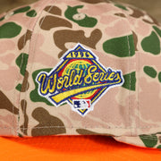 The World Series 1996 Side Patch on the New York Yankees Duck Camo Neon Orange Undervisor World Series Side Patch Fitted Cap | Camo Tan 59Fifty Cap