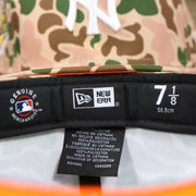 The Tags on the New York Yankees Duck Camo Neon Orange Undervisor World Series Side Patch Fitted Cap | Camo Tan 59Fifty Cap
