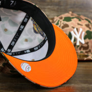 The Undervisor on the New York Yankees Duck Camo Neon Orange Undervisor World Series Side Patch Fitted Cap | Camo Tan 59Fifty Cap