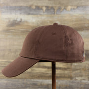 The wearer's left of the Chocolate Bent Brim Blank Baseball Hat | Brown Dad Hat