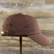 The wearer's right on the Chocolate Bent Brim Blank Baseball Hat | Brown Dad Hat