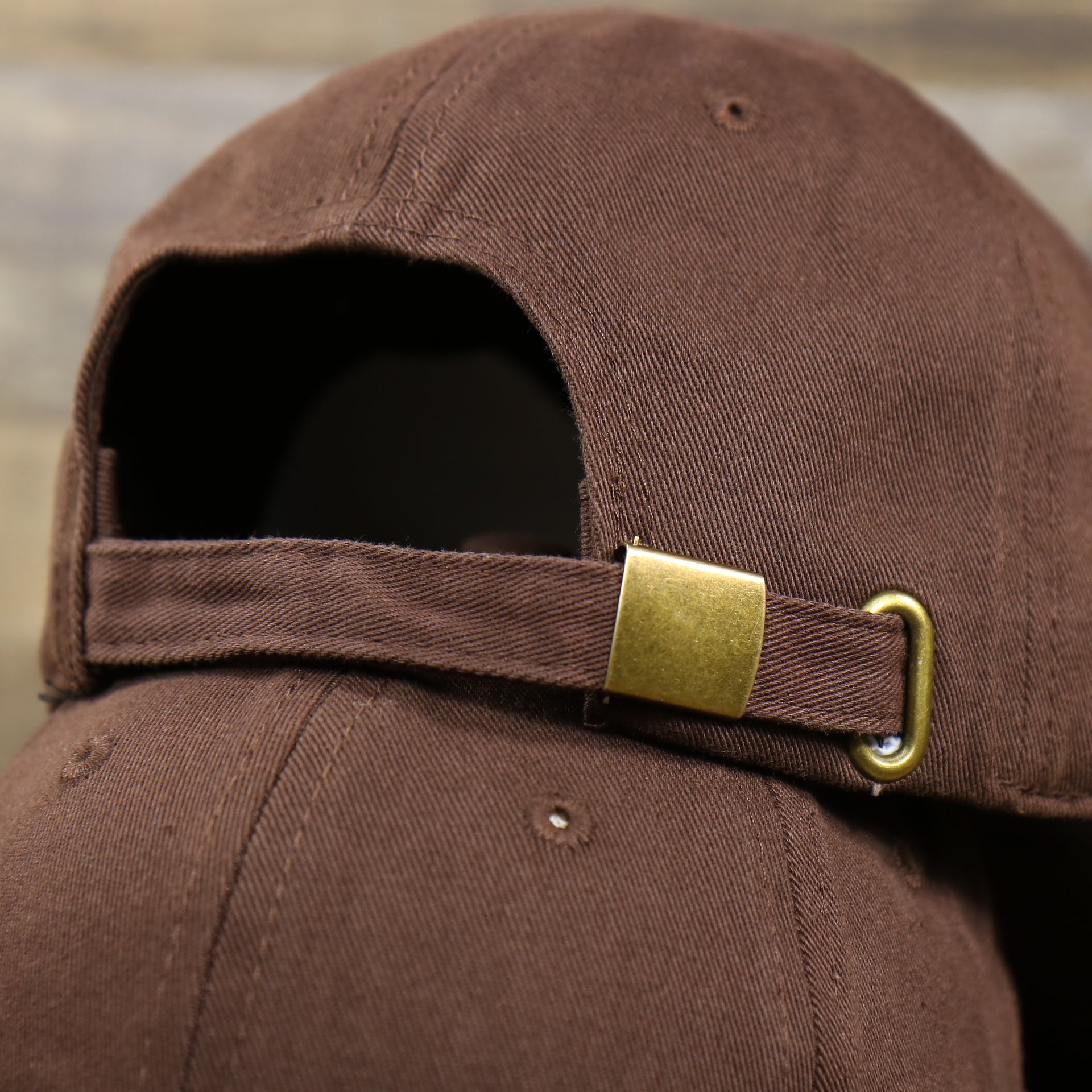 The Brown Adjustable Strap with Metallic Buckle on the Chocolate Bent Brim Blank Baseball Hat | Brown Dad Hat