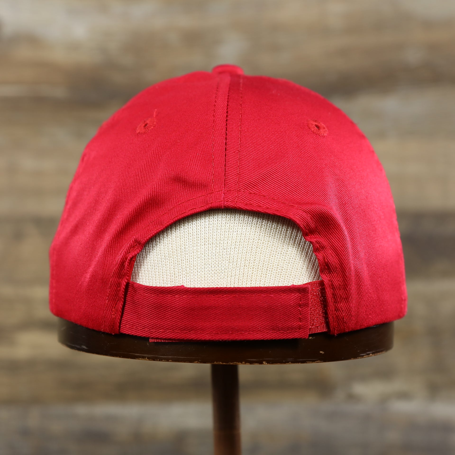 The backside of the Youth Cardinal Red Flat Brim Blank Baseball Hat | Kid’s Red Dad Hat