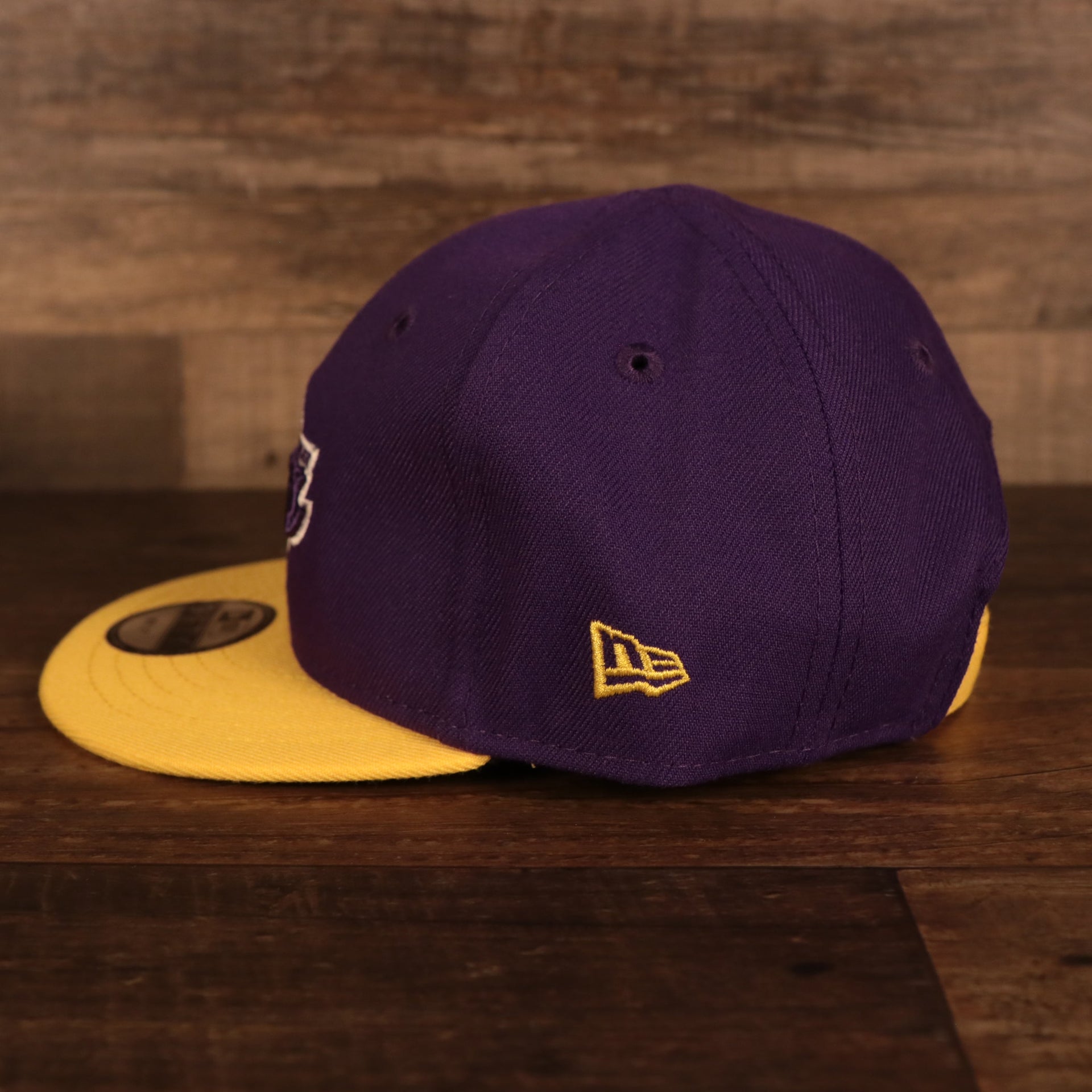 Wearer's left of the Los Angeles Lakers My 1st 9Fifty Baby Snapback Hat | Purple/Yellow