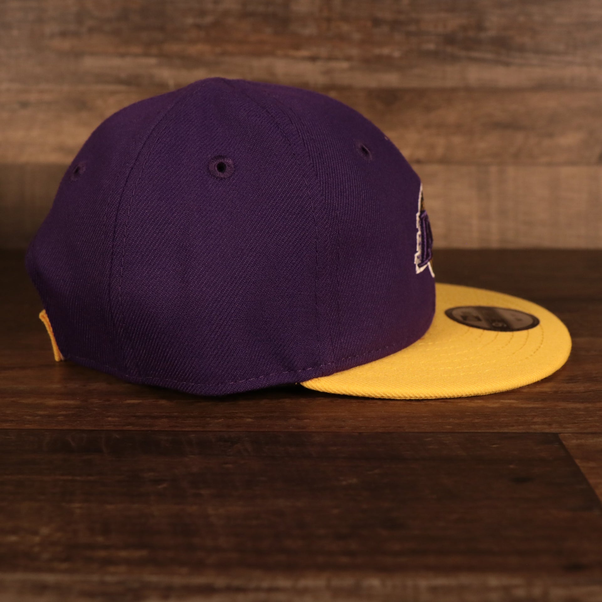 Wearer's right of the Los Angeles Lakers My 1st 9Fifty Baby Snapback Hat | Purple/Yellow