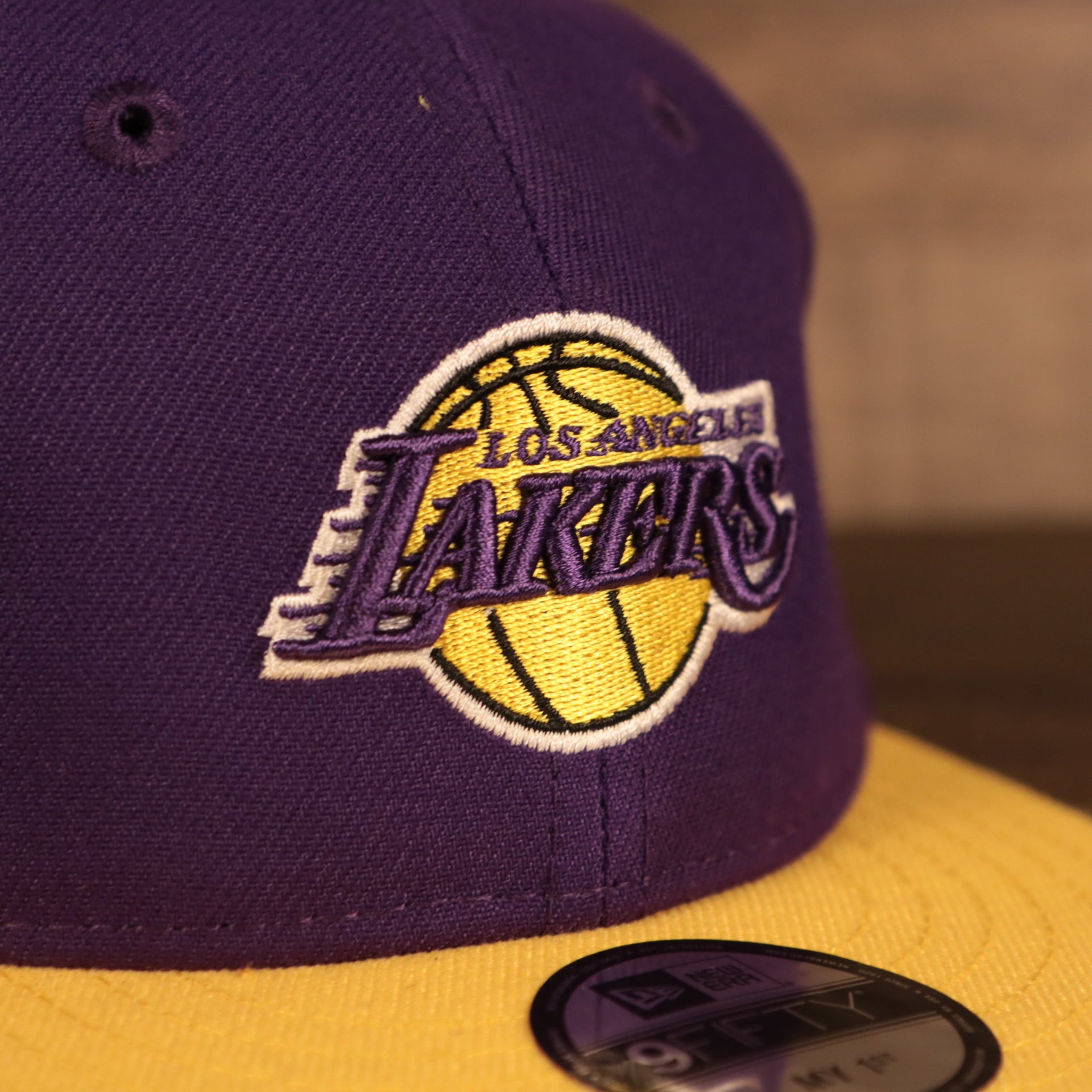 Close up of the Lakers logo on the Los Angeles Lakers My 1st 9Fifty Baby Snapback Hat | Purple/Yellow