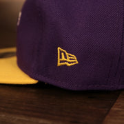 Close up of the New Era logo on the Los Angeles Lakers My 1st 9Fifty Baby Snapback Hat | Purple/Yellow