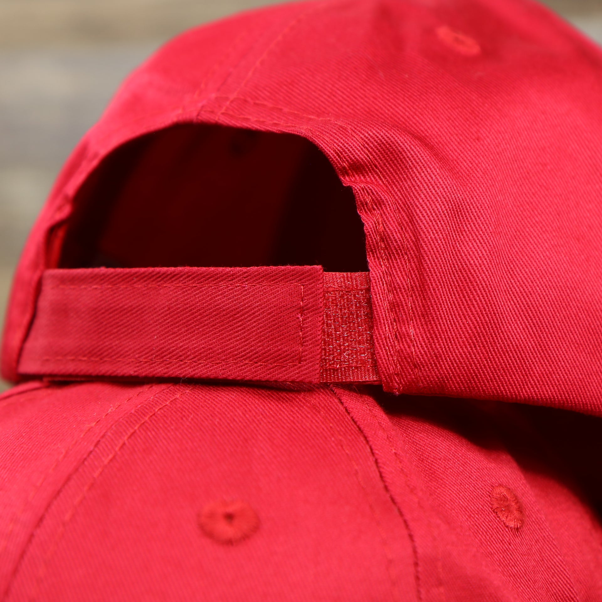 The Hooks and Loops strap on the Youth Cardinal Red Flat Brim Blank Baseball Hat | Kid’s Red Dad Hat