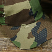 The visor on the Forest Camo Bent Brim Distressed Blank Baseball Hat | Dark Green Dad Hat