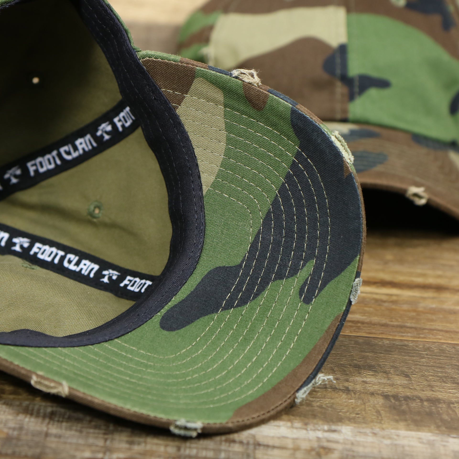 The undervisor on the Forest Camo Bent Brim Distressed Blank Baseball Hat | Dark Green Dad Hat