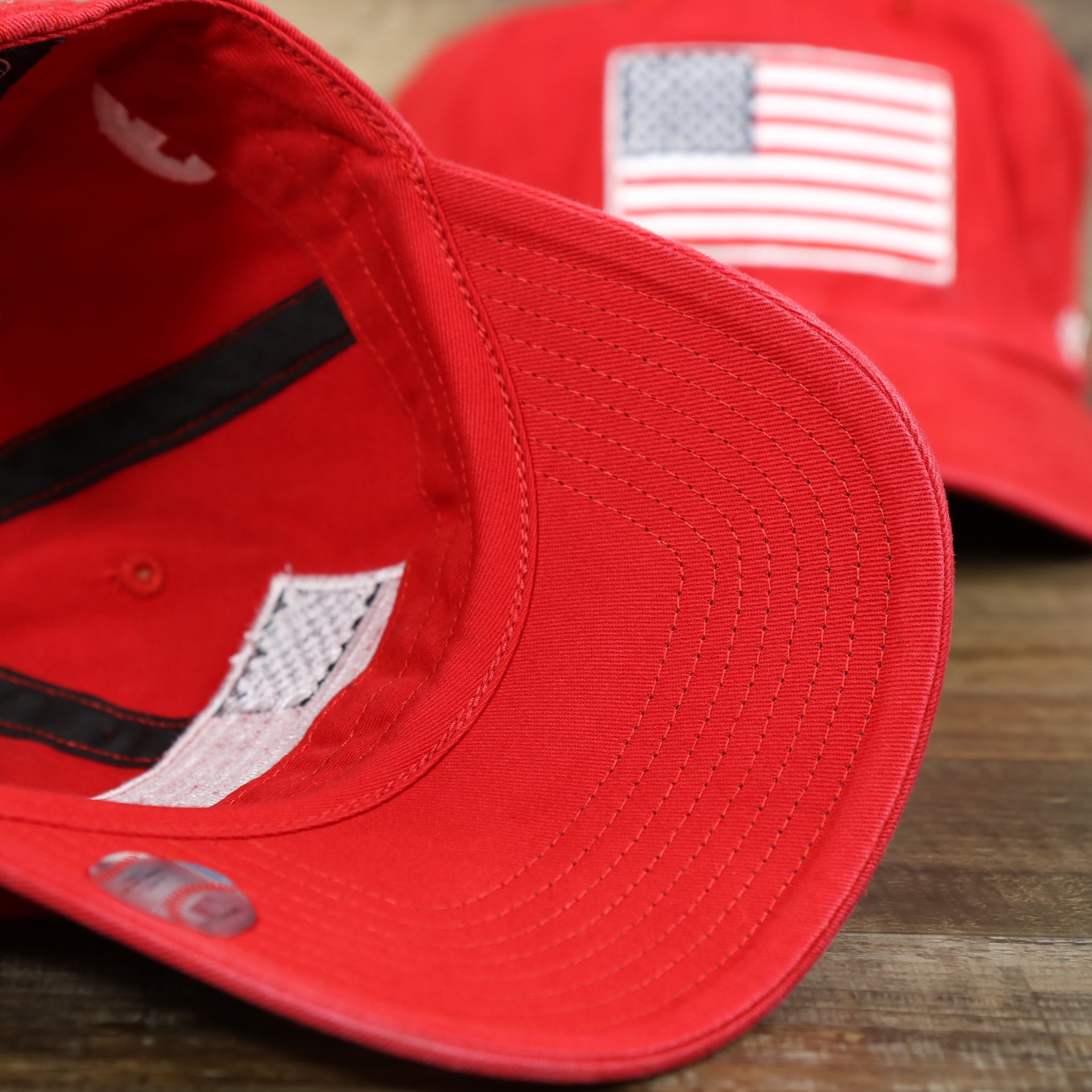 The undervisor on the Philadelphia Phillies SIde Patch USA Flag Front Logo Stars And Stripes Dad Hat | Red Dad Hat