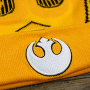 The Rebel Allince Logo on the C3PO Rebel Alliance Cuffed Logo Winter Beanie With Pom Pom | Yellow Winter Beanie