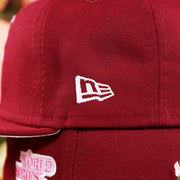 The New Era Logo on the Cooperstown Philadelphia Philadelphia Pink Undervisor Sakura Tree Embroidered 59Fifty Fitted Cap | Maroon 59Fifty Cap