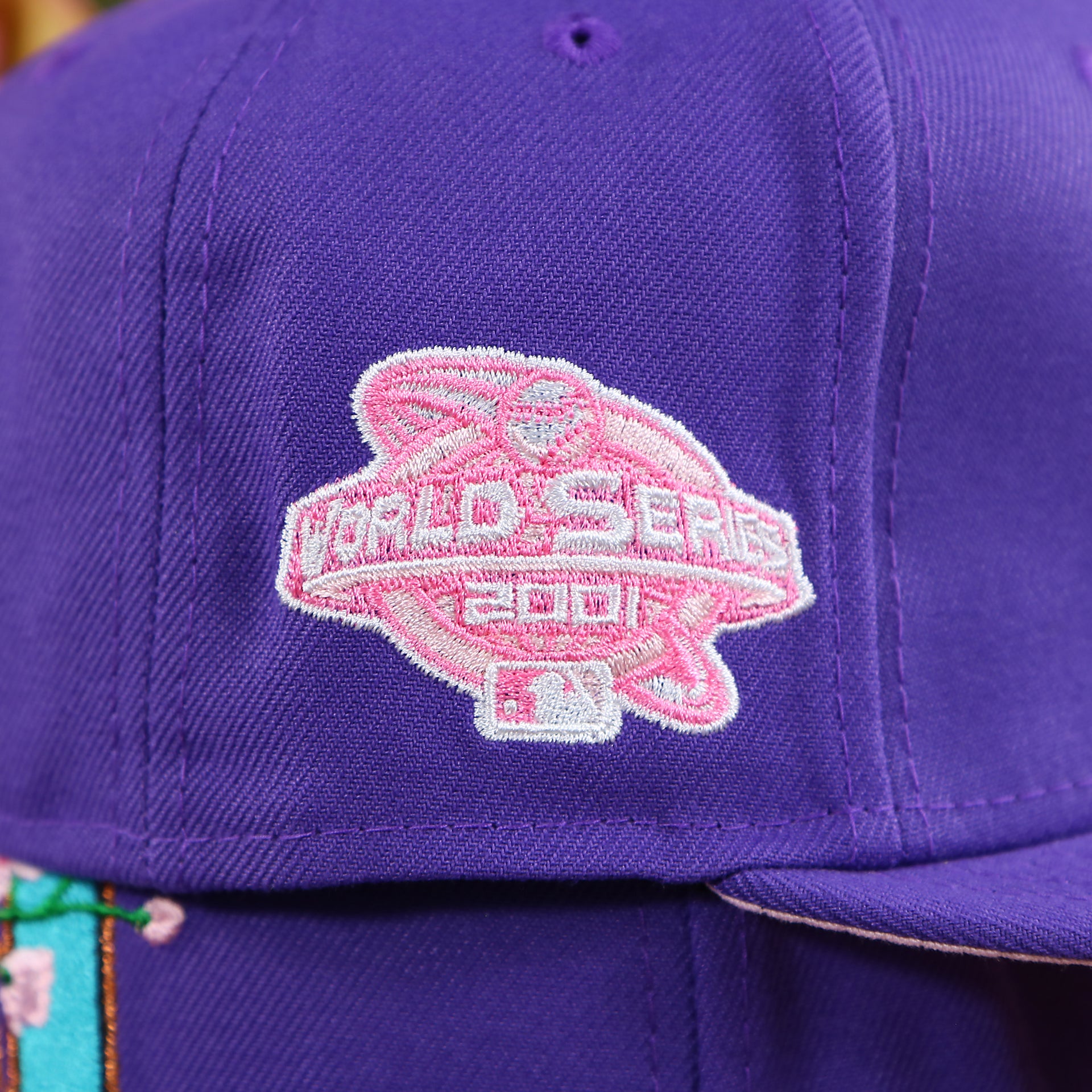 The 2001 World Series Pink Side Patch on the Cooperstown Arizona Diamondbacks Pink Undervisor Sakura Tree Embroidered 59Fifty Fitted Cap | Purple 59Fifty Cap