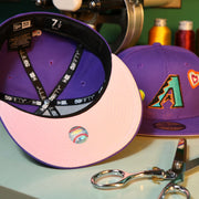 The Pink Undervisor on the Cooperstown Arizona Diamondbacks All Over Embroidered Chain Stitch Heart Pink Bottom 59Fifty Fitted Cap | Purple 59Fifty Cap