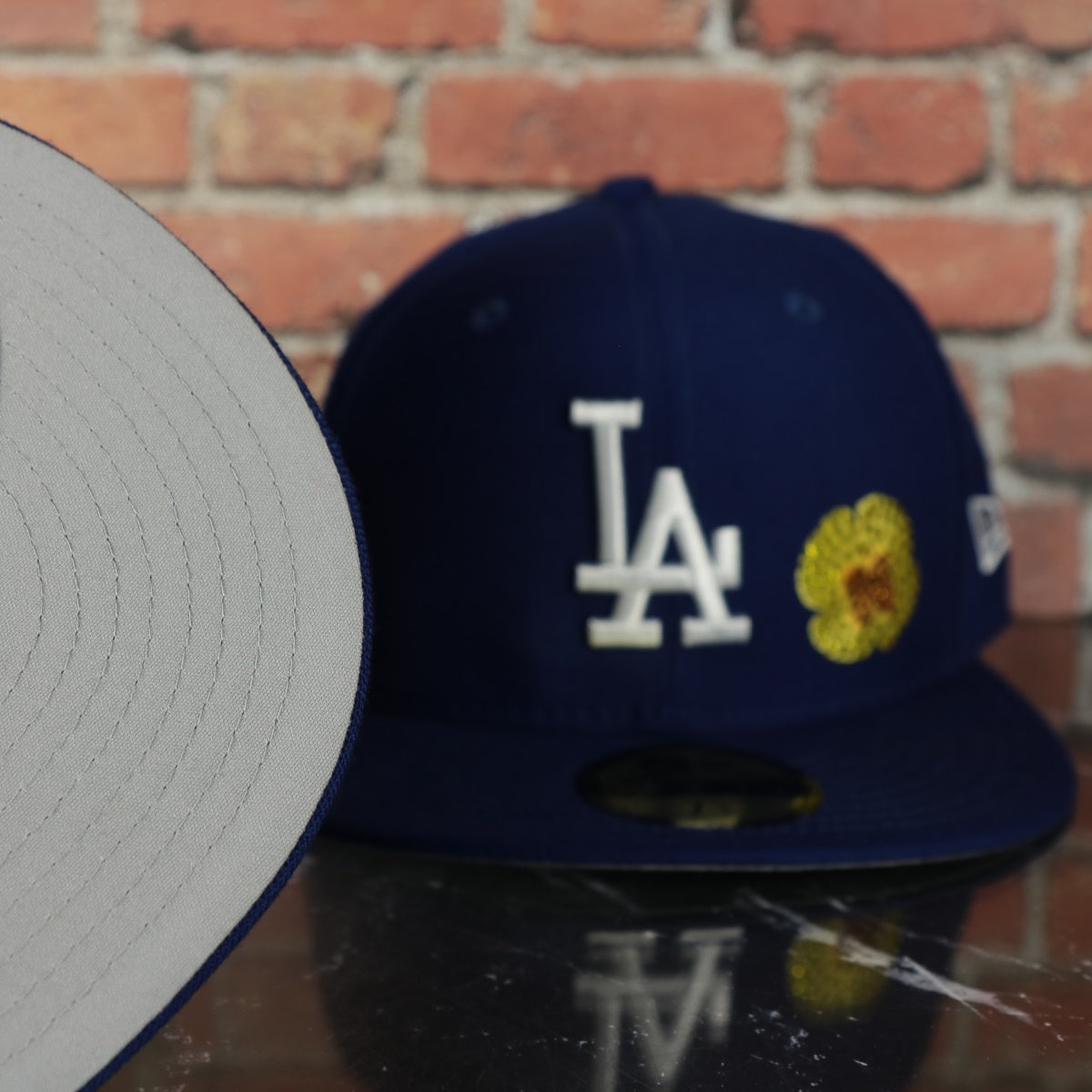 grey under visor on the Los Angeles Dodgers Iced Out Side Patch Flower Star Gray Bottom Crystal Icons 59Fifty Fitted Cap