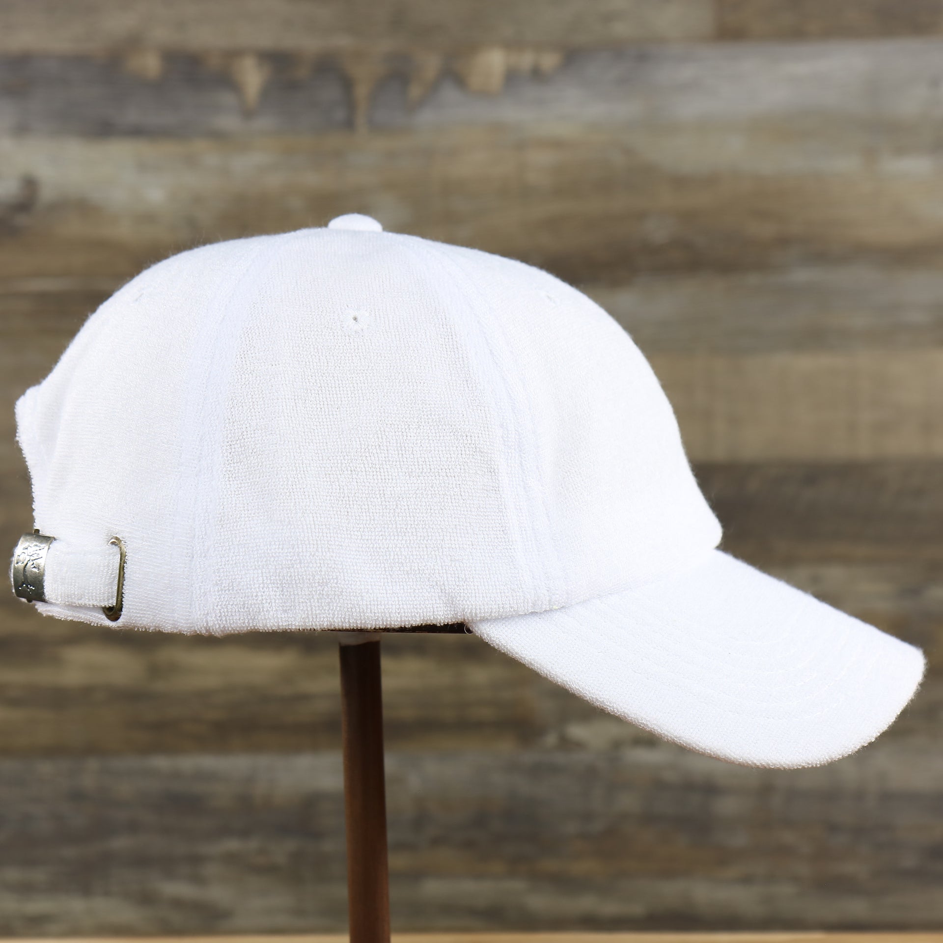 The wearer's right of the Blank Snow White Wash Cloth Baseball Hat | White Dad Hat